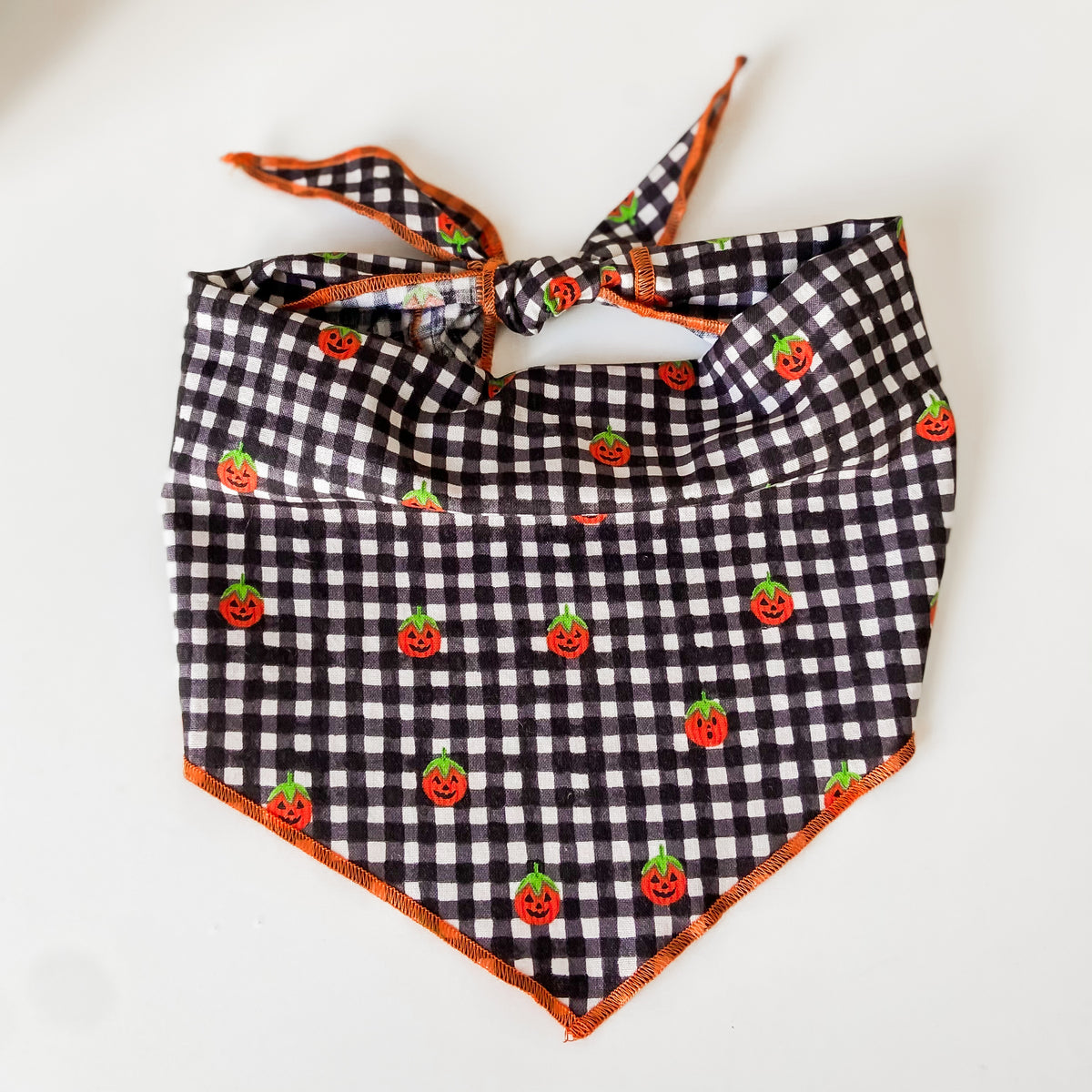 Jolly jack-o-lanterns plaid Halloween dog bandana with optional pompom trim
