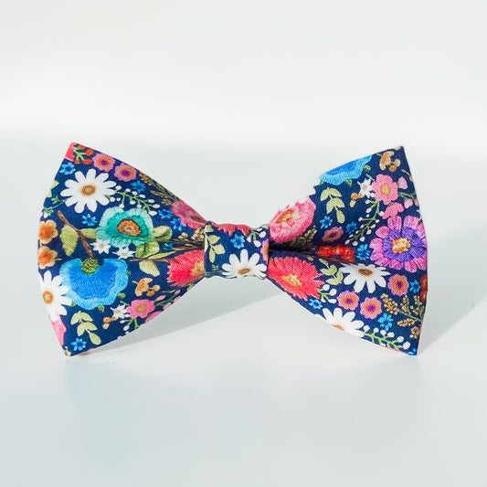 Bright floral pink and blue daisies dog bow accessory