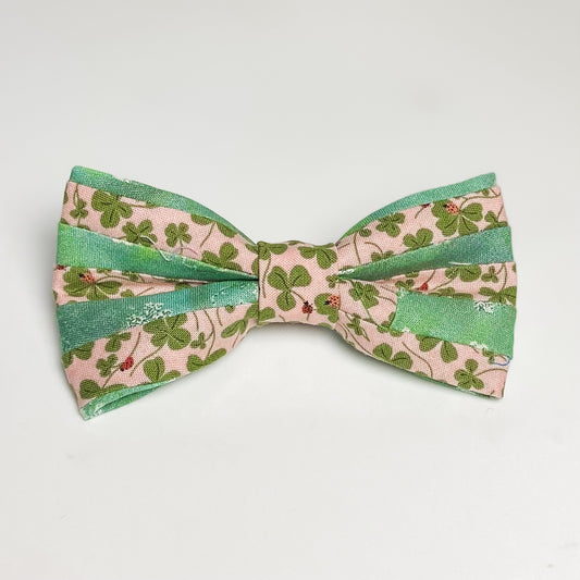 Scrappy bow with pink clover and sparkly green clover recycled dog accessory