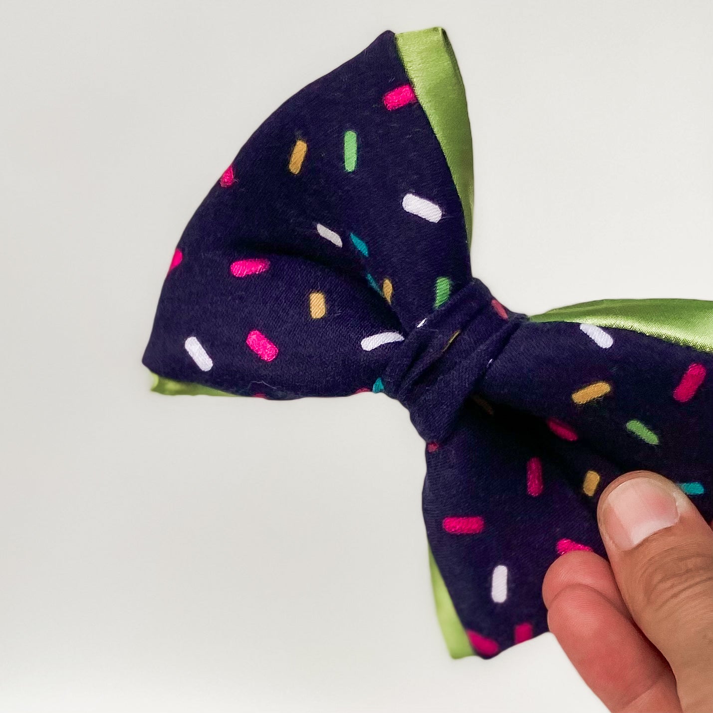 Blue sprinkles dog birthday bow with bright green trim
