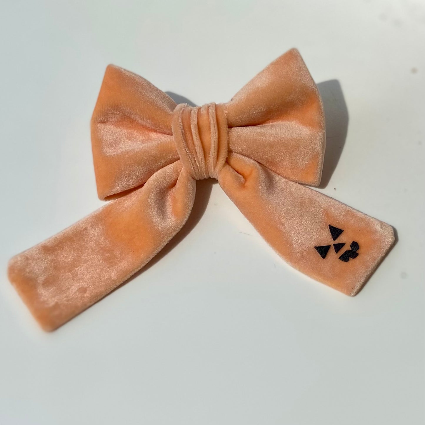 Peach spooky pumpkin face Halloween dog deluxe sailor bow accessory