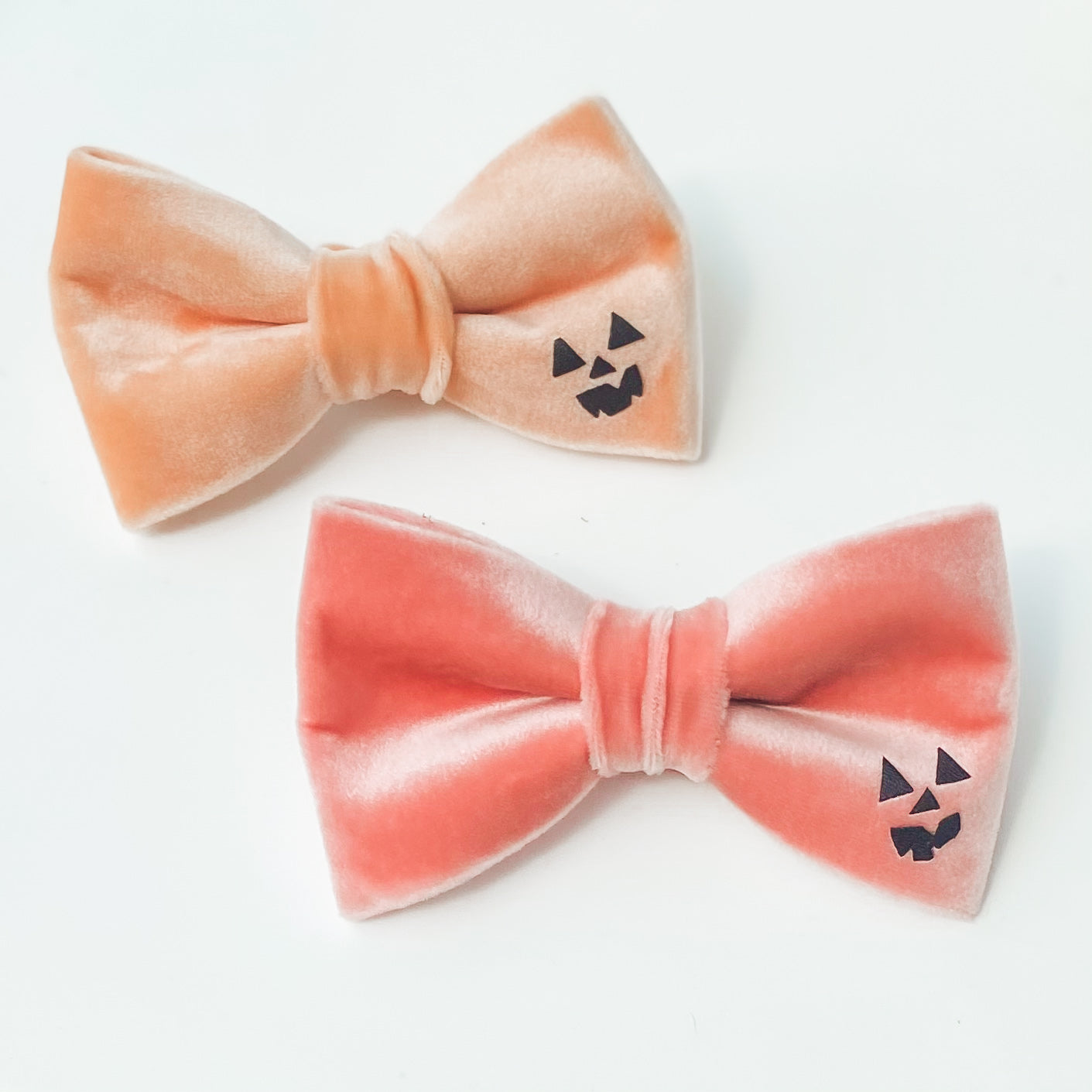 Peach spooky pumpkin face Halloween dog bow accessory