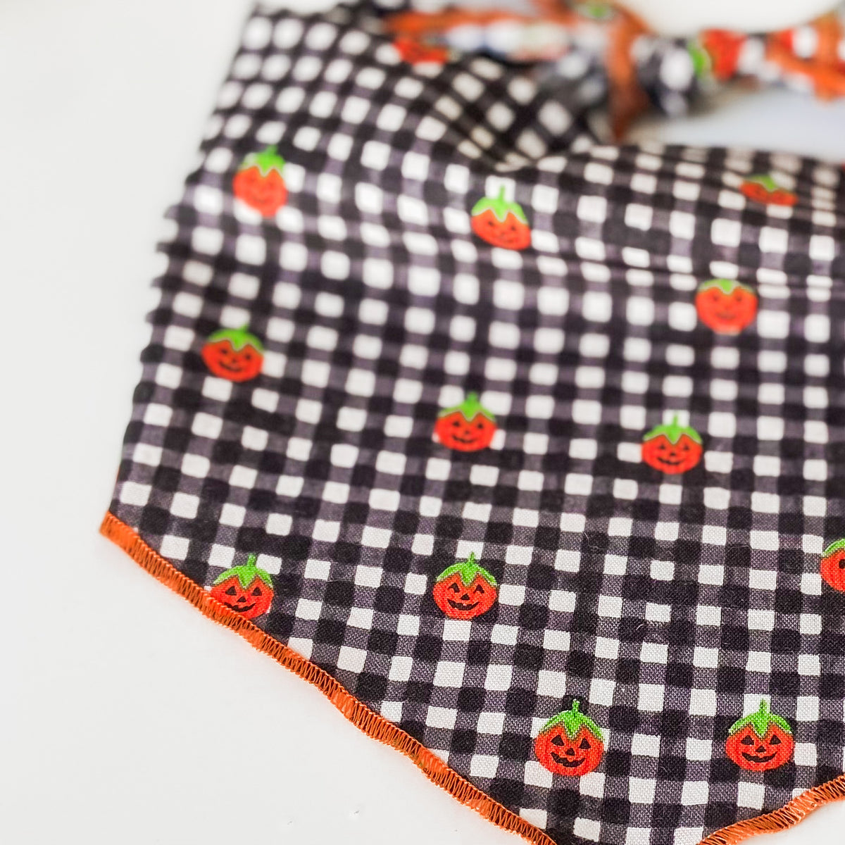 Jolly jack-o-lanterns plaid Halloween dog bandana with optional pompom trim