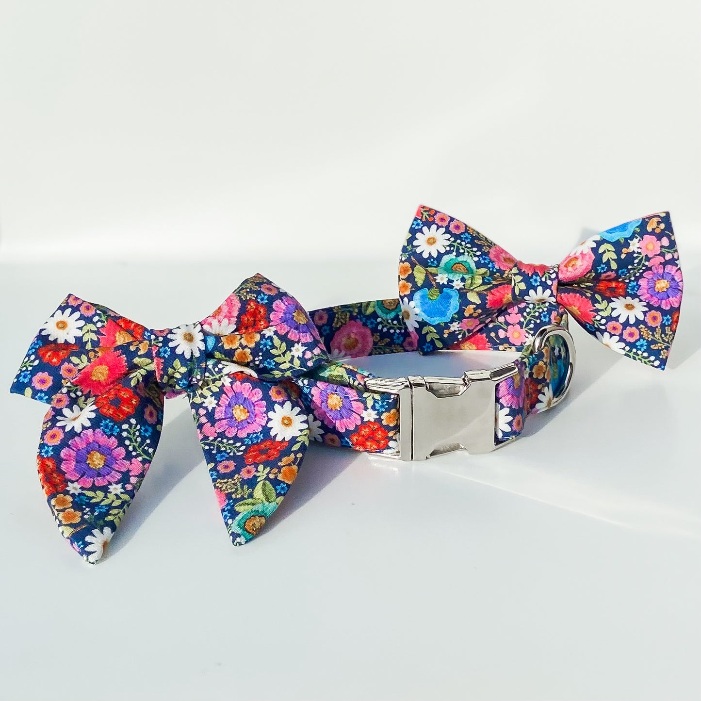Bright floral pink and blue daisies dog bow accessory