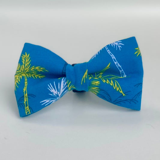 Neon palm trees on a bright blue background dog bow tie