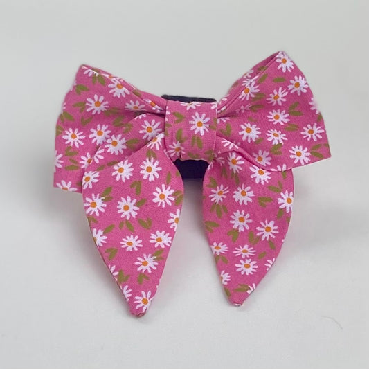 Scattered daisies on pink background sailor dog bow