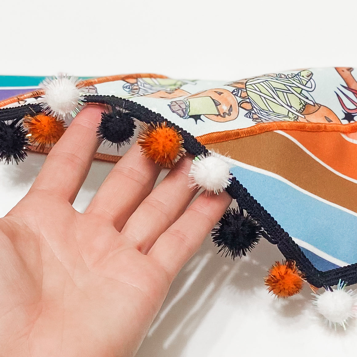 Trick-RAWR-Treat dinosaurs in costume dog bandana with sparkle pom pom trim