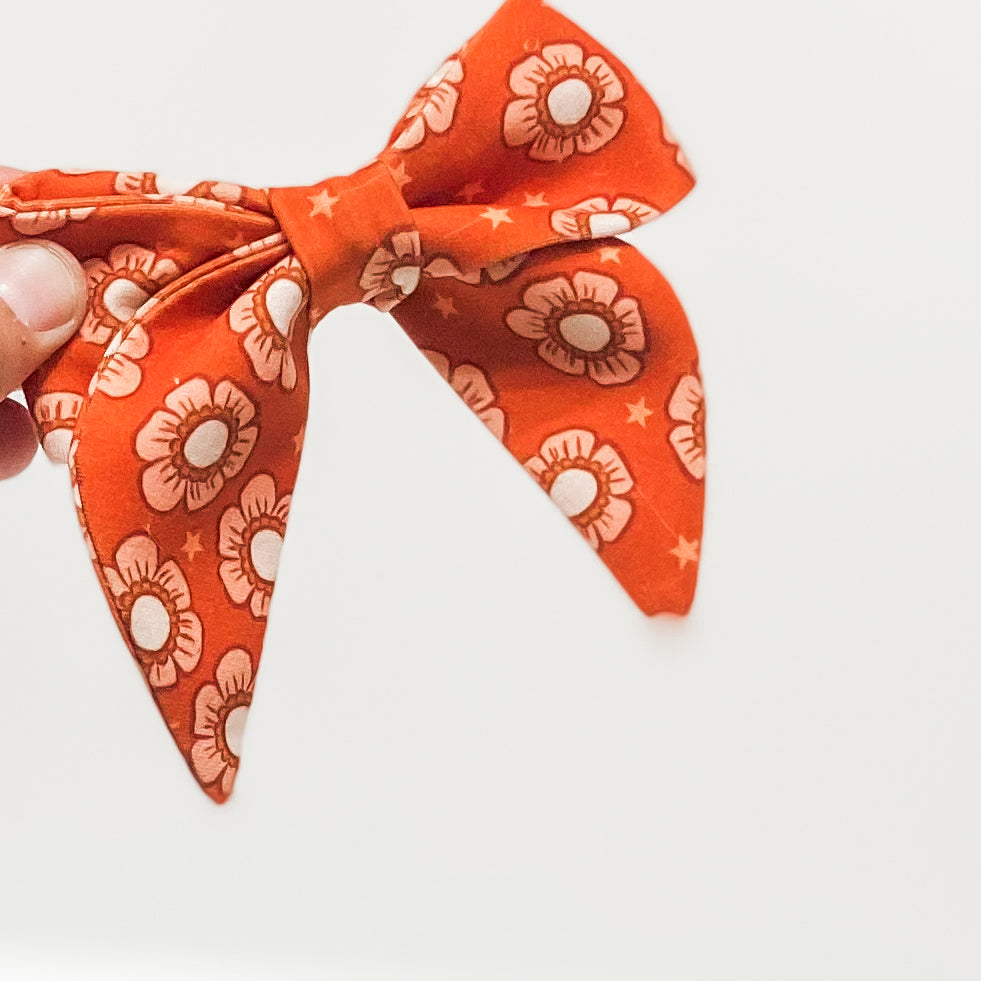 Orange and peach starry floral dog sailor bow accessory