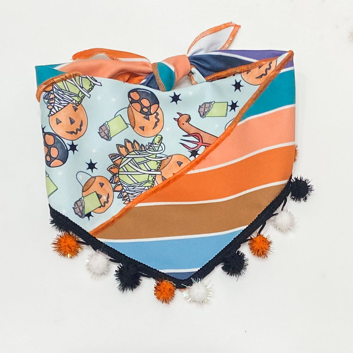 Trick-RAWR-Treat dinosaurs in costume dog bandana with sparkle pom pom trim