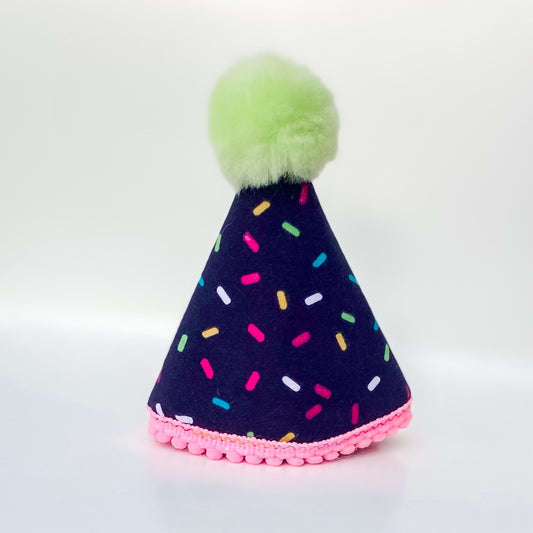 Sprinkles in dark blue pawty hat dog birthday accessory