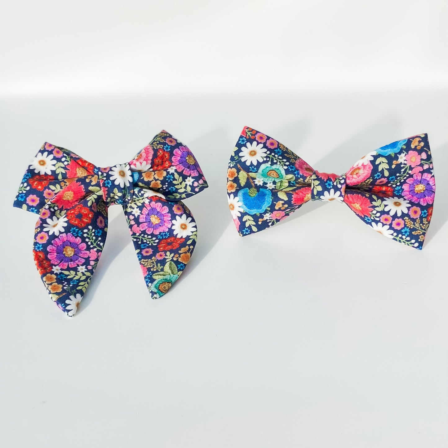 Bright floral pink and blue daisies dog bow accessory