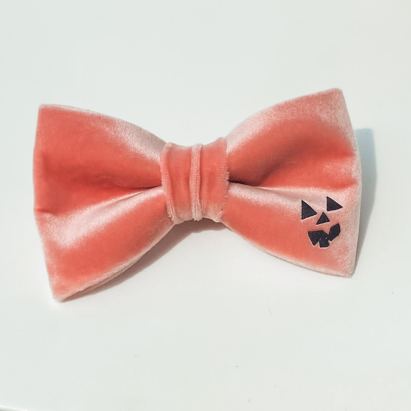 Pink spooky pumpkin face Halloween dog bow accessory